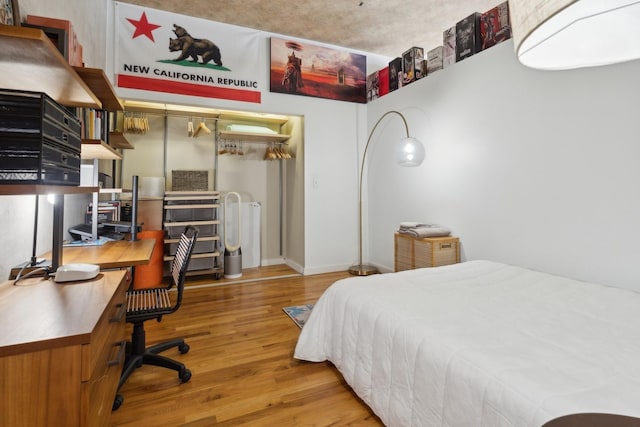 bedroom with wood-type flooring