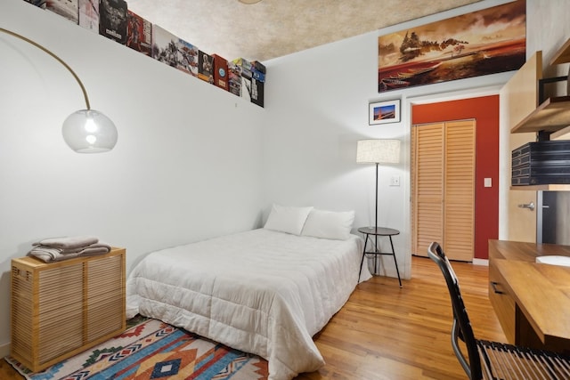 bedroom with hardwood / wood-style floors