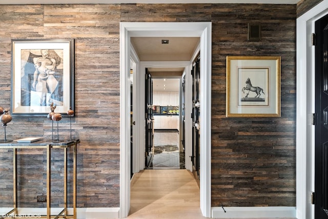 hallway with hardwood / wood-style floors