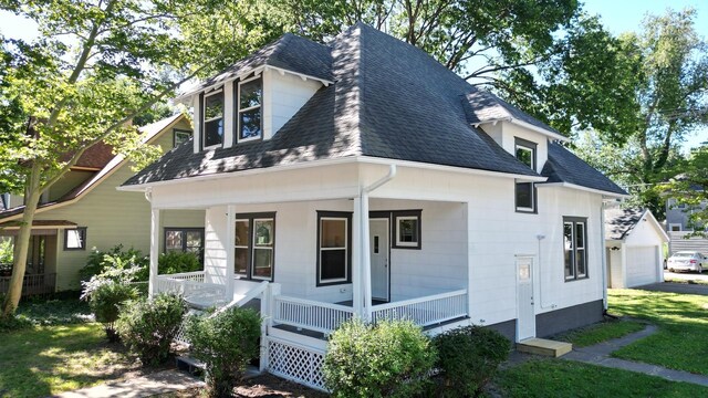 back of property with a porch