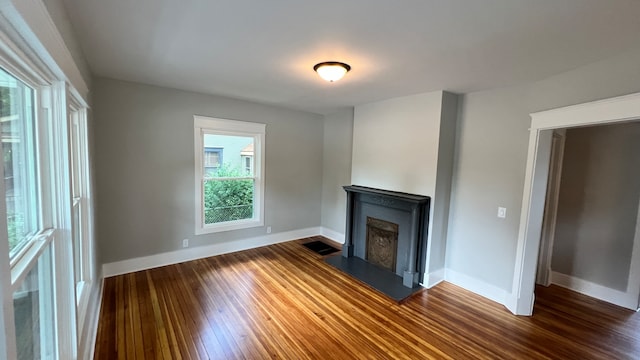 unfurnished living room featuring hardwood / wood-style flooring