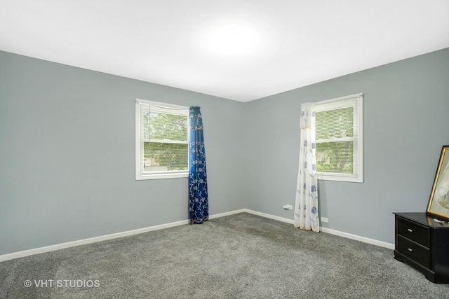 unfurnished room with carpet flooring