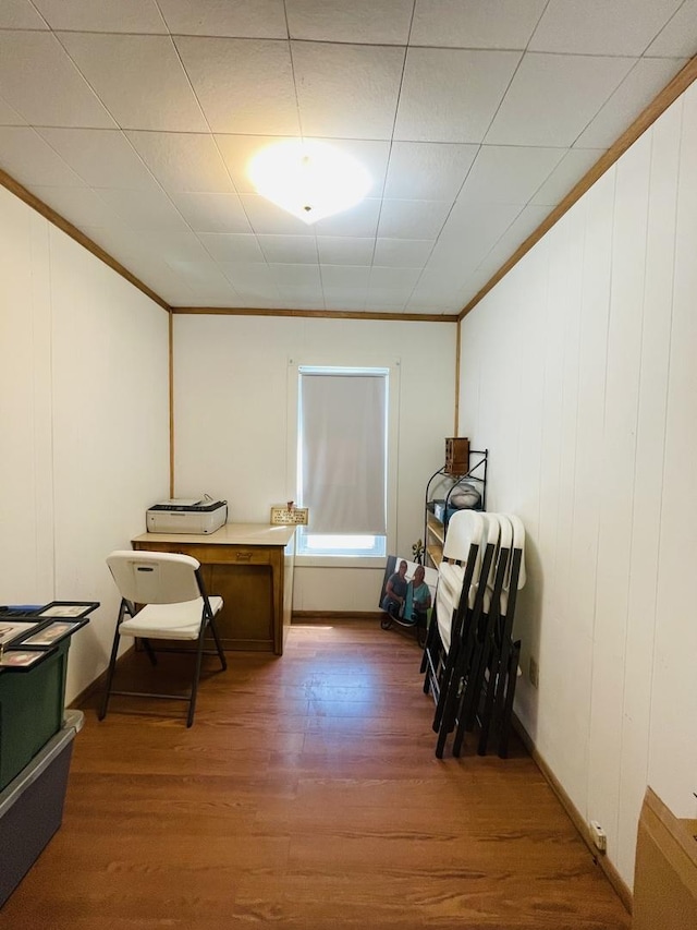 office space featuring hardwood / wood-style flooring and crown molding