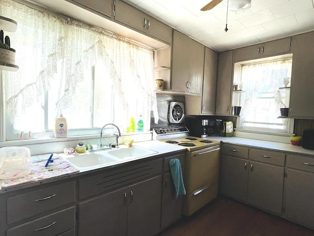 kitchen featuring sink, ceiling fan, and white electric range oven