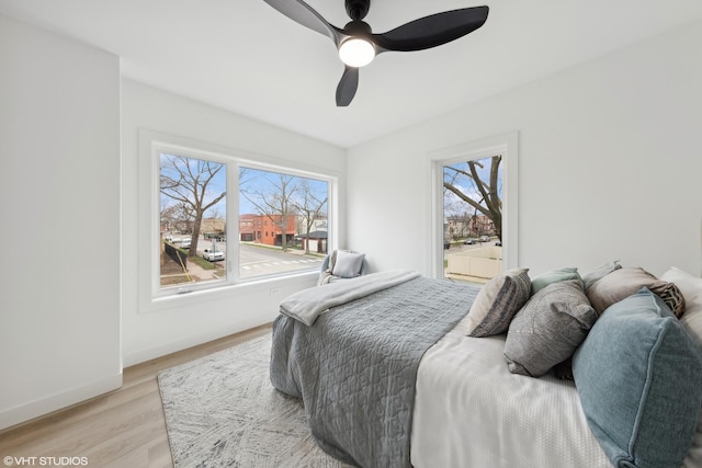 bedroom with light wood-type flooring and ceiling fan