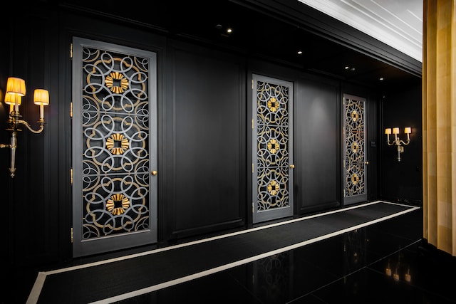 interior space featuring tile patterned floors and ornamental molding