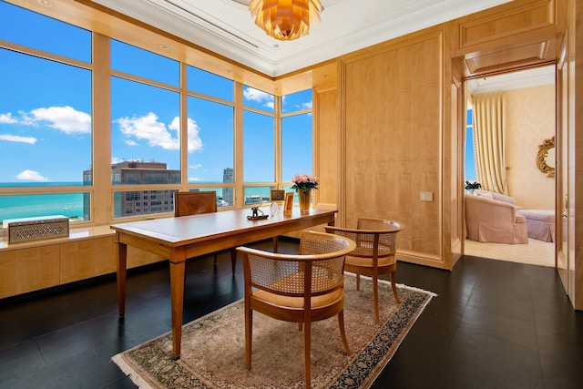 office with crown molding and a water view