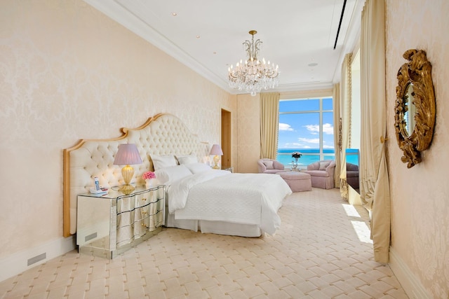 bedroom featuring a notable chandelier, ornamental molding, and a water view