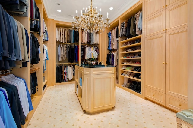 walk in closet with a notable chandelier