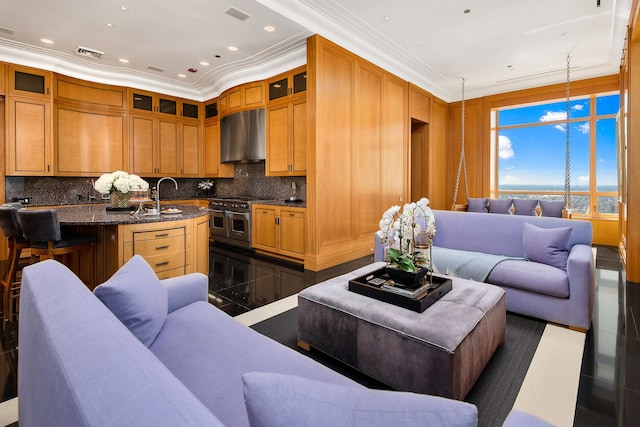 living room featuring sink and ornamental molding