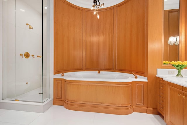 bathroom featuring vanity and separate shower and tub