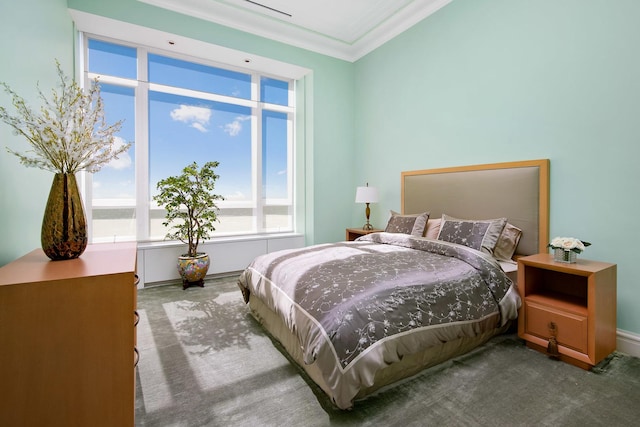 carpeted bedroom featuring ornamental molding