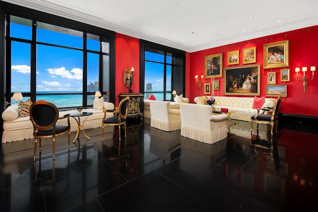 tiled dining room featuring a water view and ornamental molding