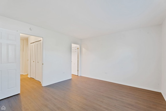 879 Trace Dr Unit 106, Buffalo Grove, IL 60089 - unfurnished room featuring wood finished floors and baseboards