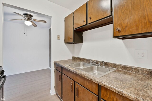 879 Trace Dr Unit 106, Buffalo Grove, IL 60089 - kitchen with a sink, baseboards, light wood-style flooring, and ceiling fan