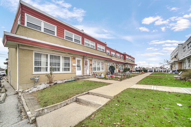 view of front of property with a front lawn