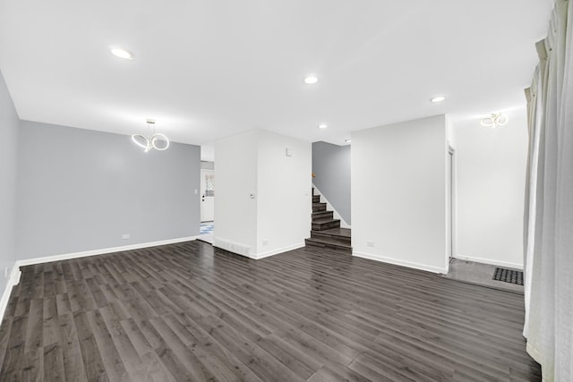 interior space featuring dark hardwood / wood-style floors and a notable chandelier