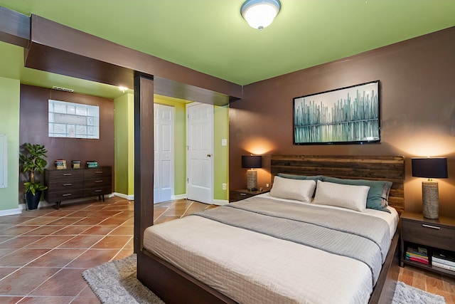 tiled bedroom featuring a closet