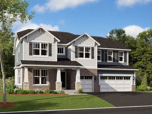 craftsman-style house featuring a front lawn and a garage