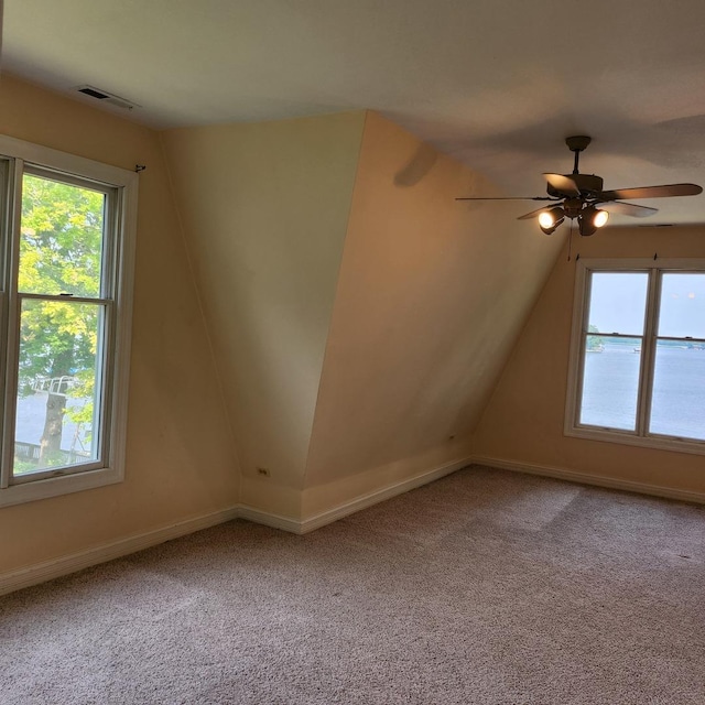 bonus room featuring carpet flooring and ceiling fan