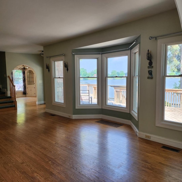 interior space featuring hardwood / wood-style flooring and a healthy amount of sunlight