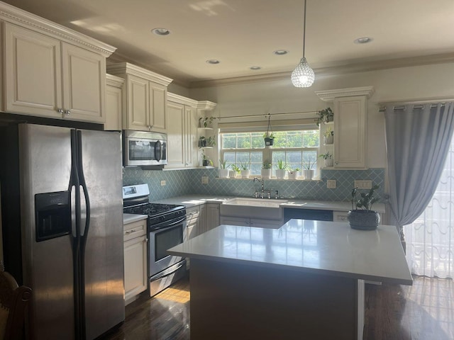 kitchen featuring tasteful backsplash, dark hardwood / wood-style floors, stainless steel appliances, and decorative light fixtures