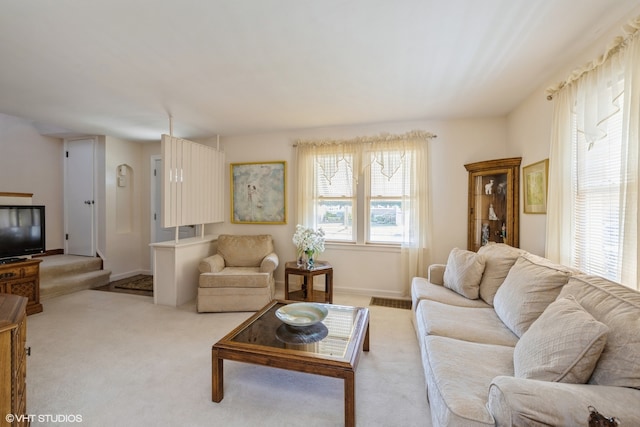 living room featuring light carpet