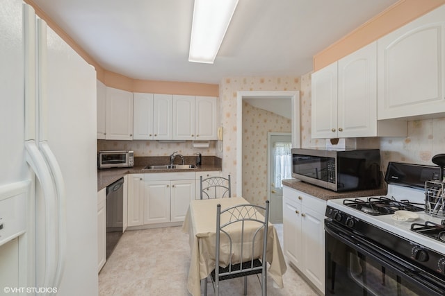 kitchen featuring white cabinetry, black appliances, and sink