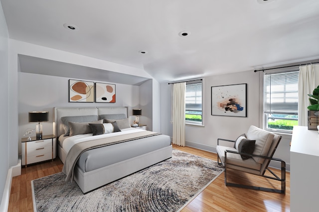 bedroom featuring light wood-type flooring and multiple windows