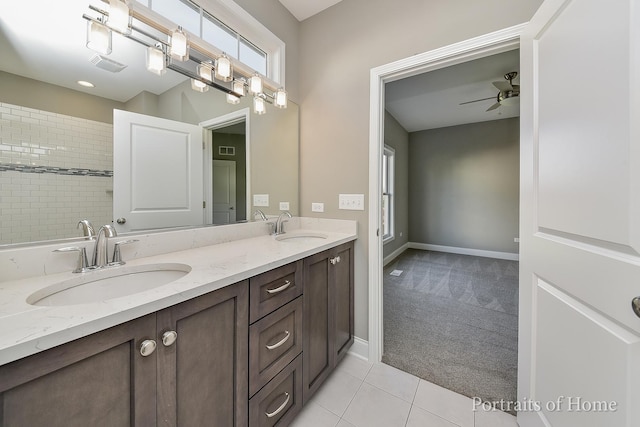 bathroom featuring tile patterned flooring, vanity, and ceiling fan