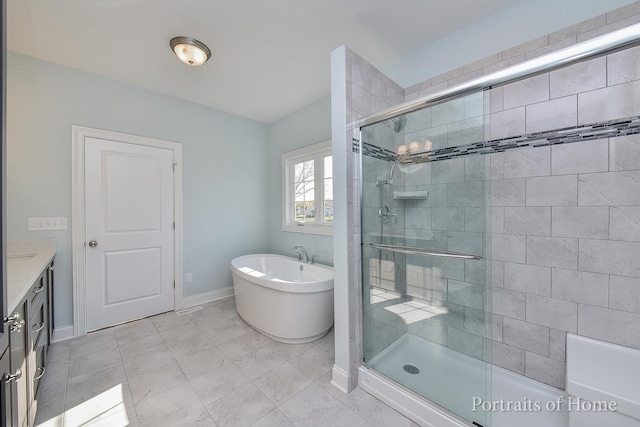 bathroom with plus walk in shower, vanity, and tile patterned flooring