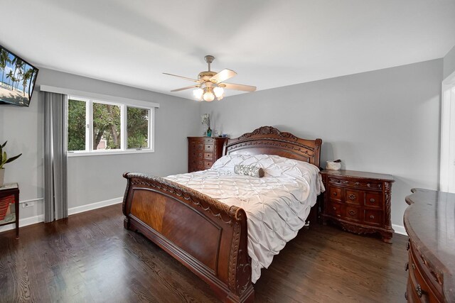 bedroom featuring ceiling fan and dark hardwood / wood-style flooring