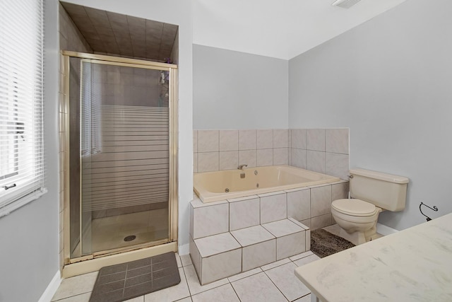 full bathroom with tile patterned floors, separate shower and tub, and toilet