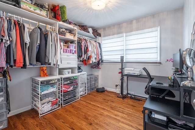 spacious closet with wood finished floors