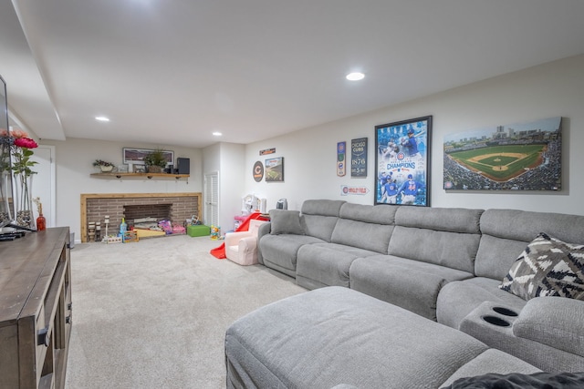 carpeted living area featuring a brick fireplace and recessed lighting