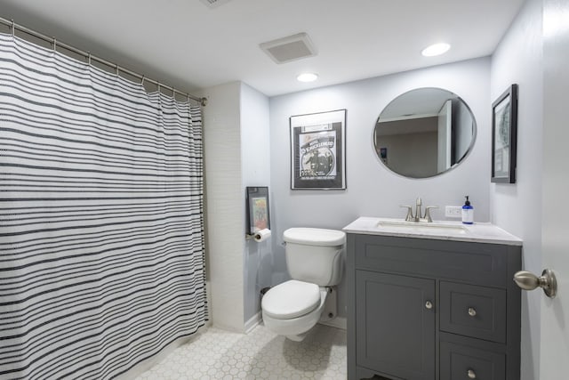 full bath with toilet, vanity, and visible vents