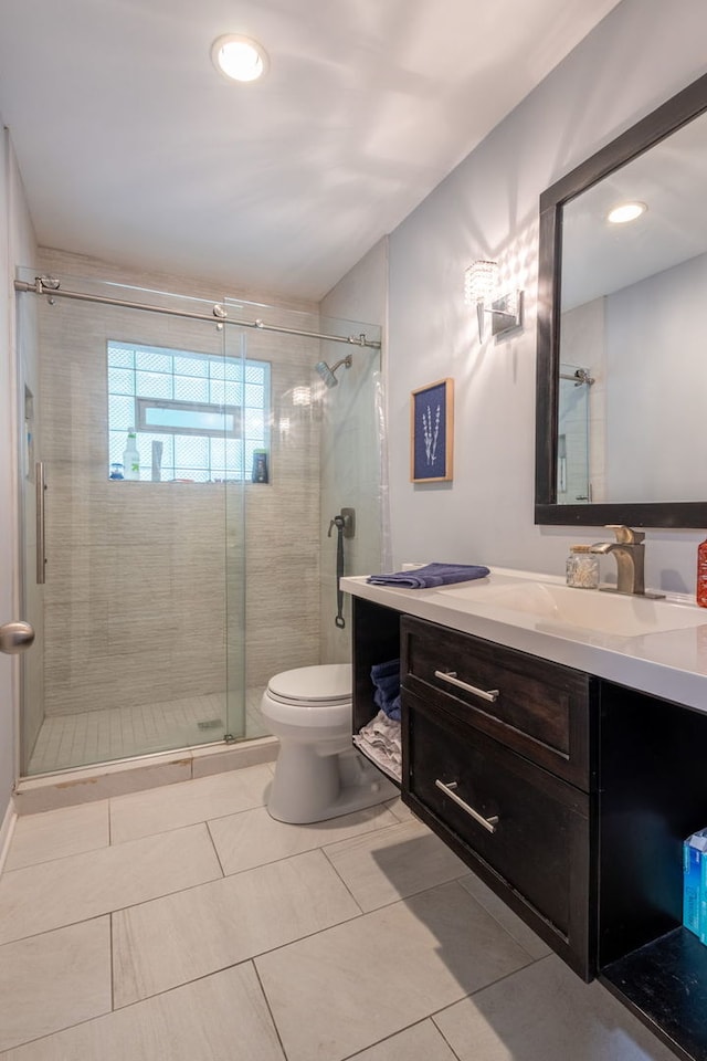 bathroom featuring toilet, vanity, recessed lighting, tile patterned flooring, and a shower stall