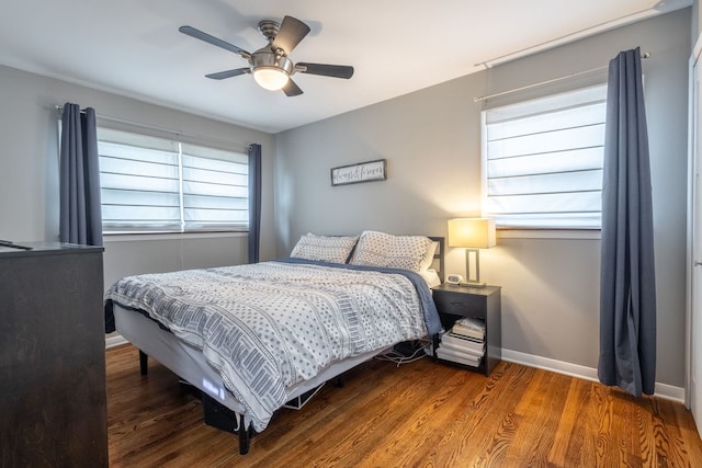 bedroom with baseboards, a ceiling fan, and wood finished floors