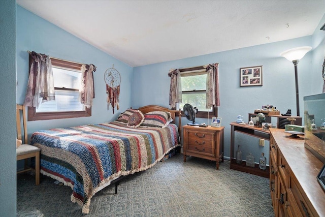 carpeted bedroom with vaulted ceiling