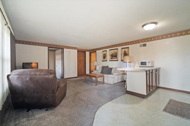 living room featuring visible vents, light colored carpet, and baseboards