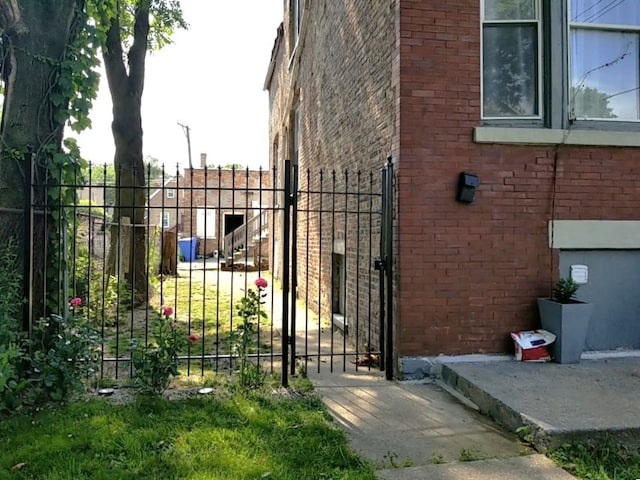 view of gate featuring fence