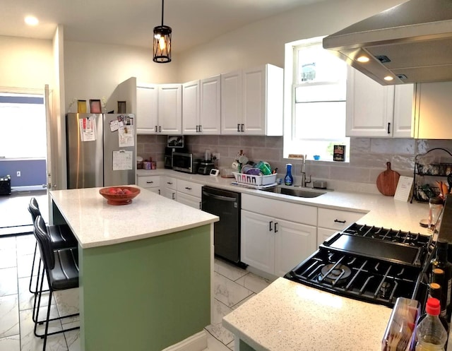 kitchen with extractor fan, black dishwasher, decorative backsplash, freestanding refrigerator, and a sink