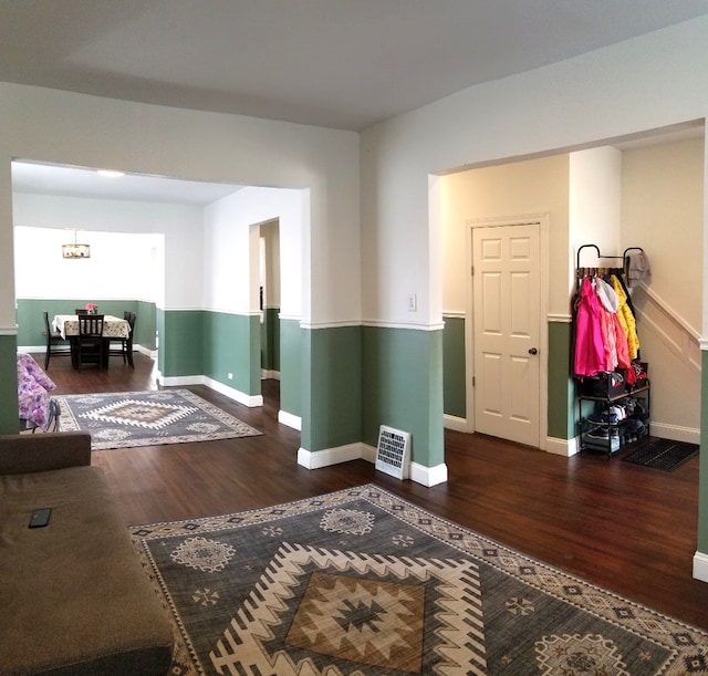 interior space featuring wood finished floors and baseboards