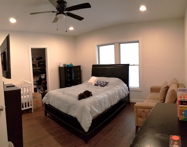 bedroom featuring dark wood finished floors, recessed lighting, baseboards, and a ceiling fan