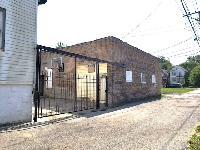 view of gate featuring fence