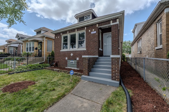 view of front of property with a front lawn