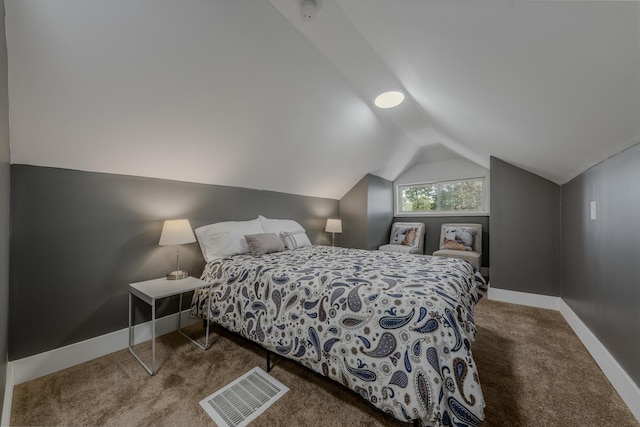 bedroom featuring lofted ceiling and carpet floors