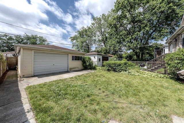 view of yard featuring an outbuilding and a garage