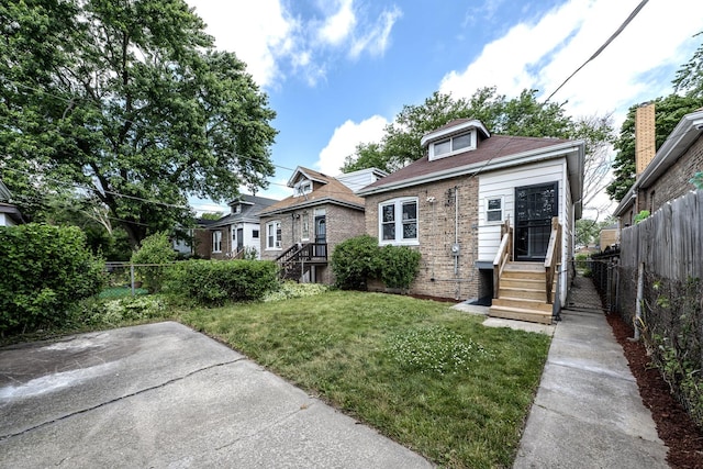 bungalow-style home featuring a patio area and a front lawn