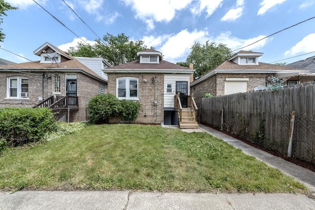 bungalow featuring a front yard